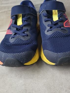 New Balance Kids Navy Blue and Yellow Sneakers with Pink Accent